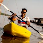 Cycling guide kayaking on the Tonle Sap