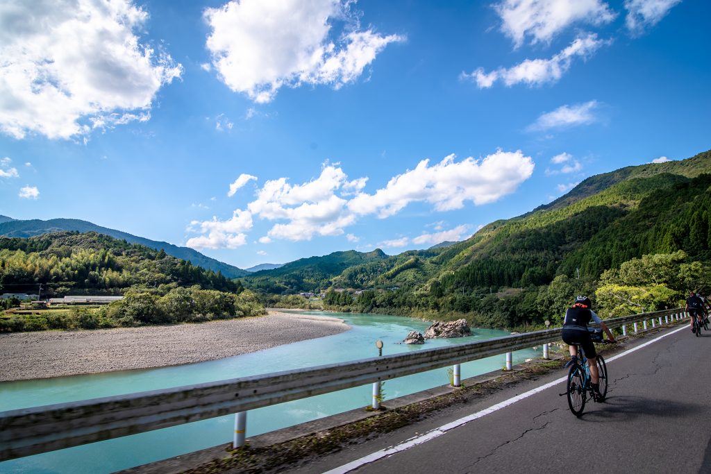 Biking along a river in Japan