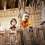 Burmese children in bamboo hut