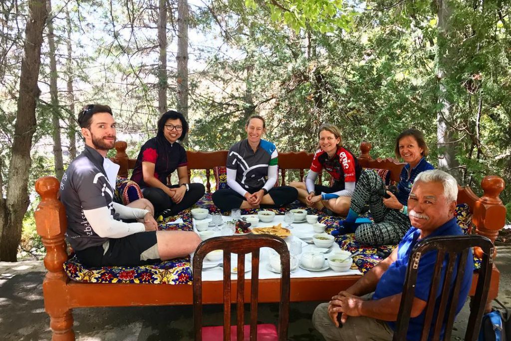 Six travelers eated eating traditional Uzbek food