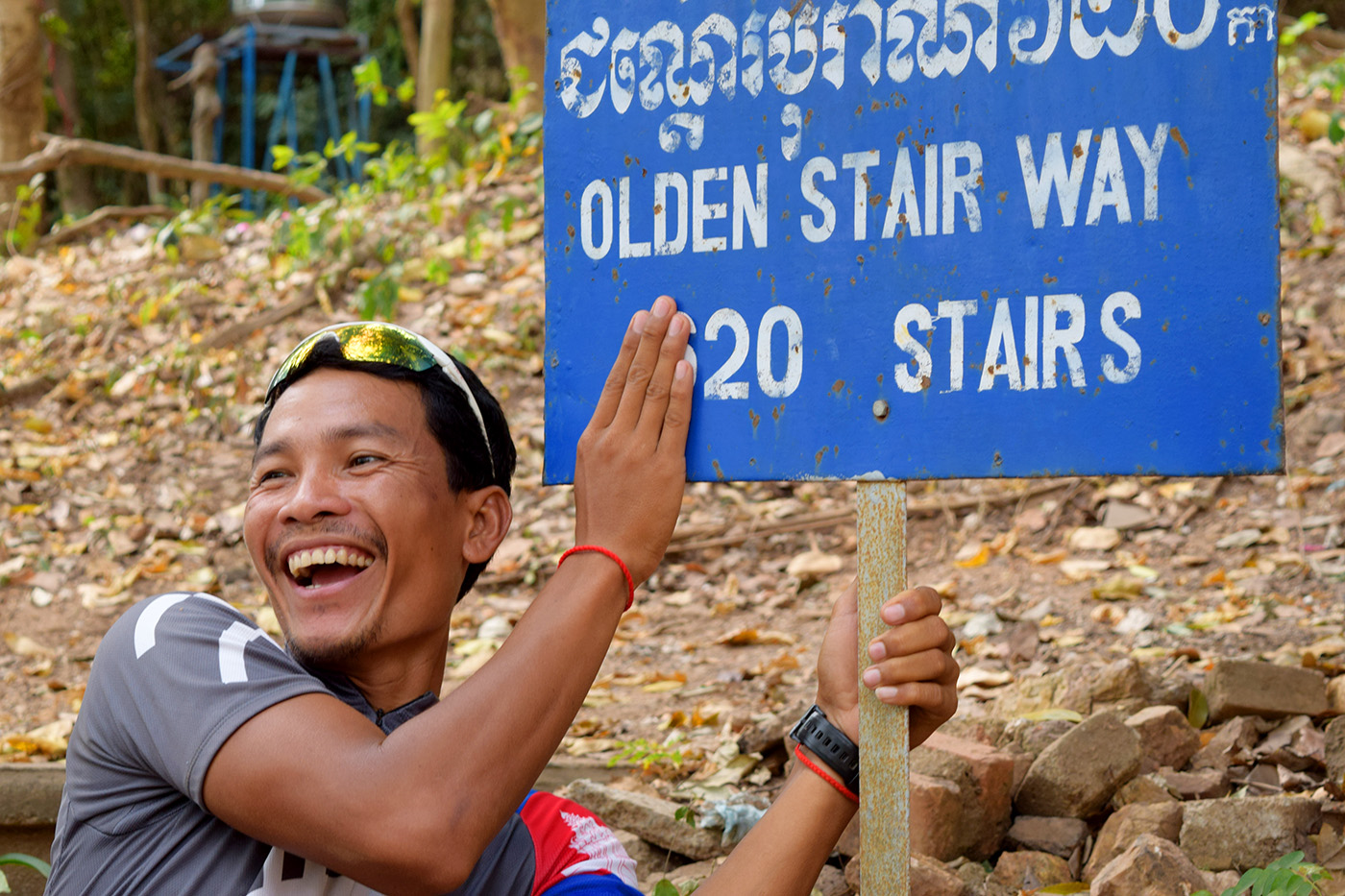 Tour guide laughing stairway sign