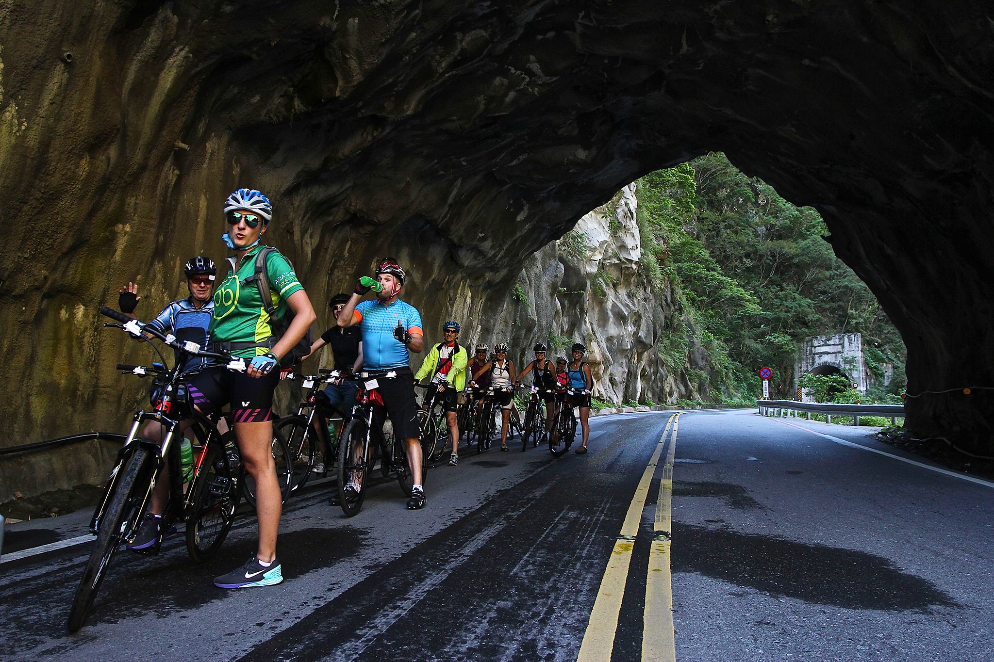 Cyclists stopping for a break in a tunnel in Taiwan