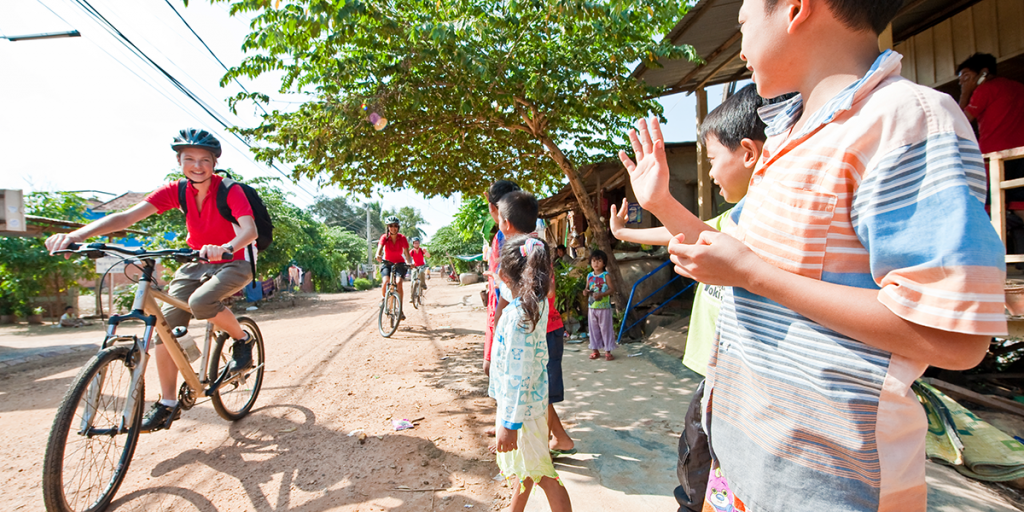Friendly locals while touring Cambodia on two-wheels