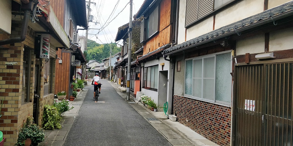 Cycling through back street of Kyoto