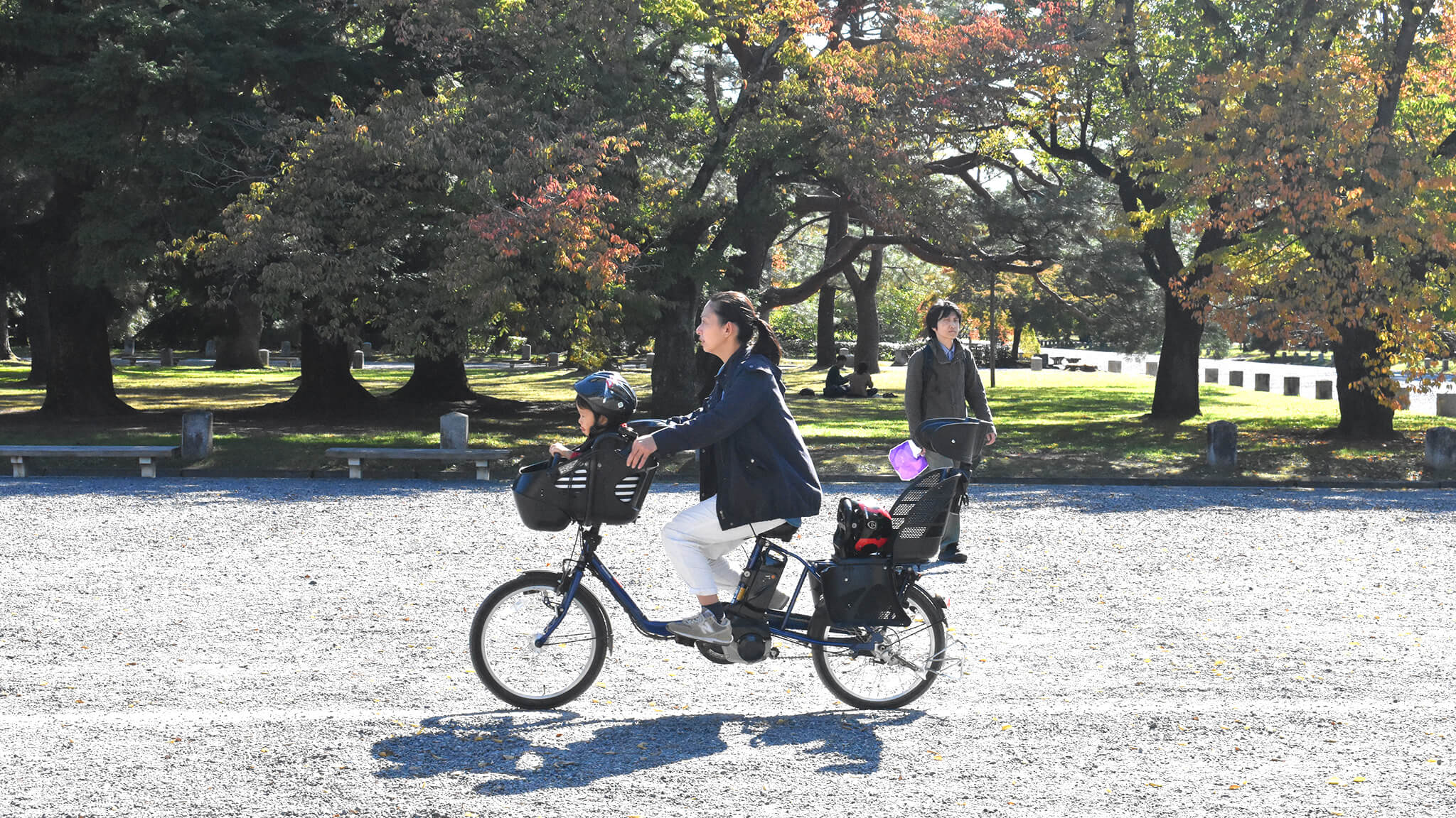 Mother and child on e-bike in Japan