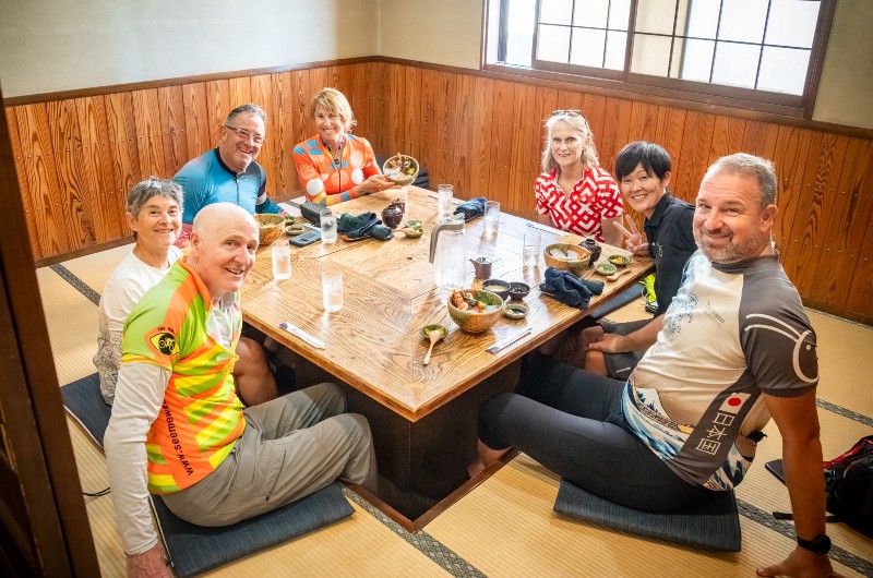 Eating at a traditional Japanese restaurant on a cycling vacation with Grasshopper Adventures in Japan.